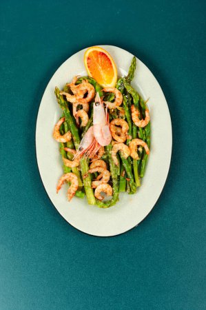 Salad with prawns, green asparagus. Boiled shrimp with green asparagus. Top view, copy space.