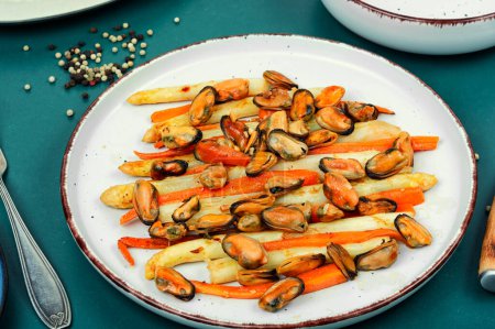 Photo for Seafood salad with white asparagus and mussels. Luxury dish. - Royalty Free Image