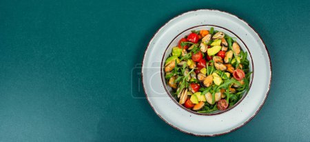Photo for Plate with vitamin salad of mussels, arugula, tomato and avocado. Copy space. - Royalty Free Image