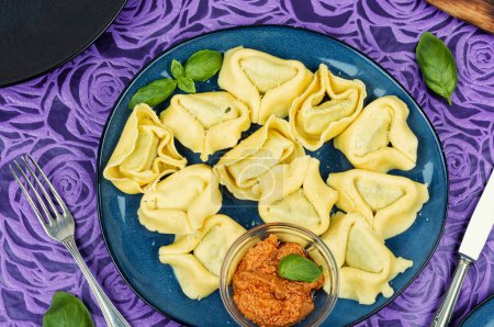 Photo for Tortellini, Italian food or filled dumplings. Tortelli or tortelloni, Italian pasta, ravioli. - Royalty Free Image