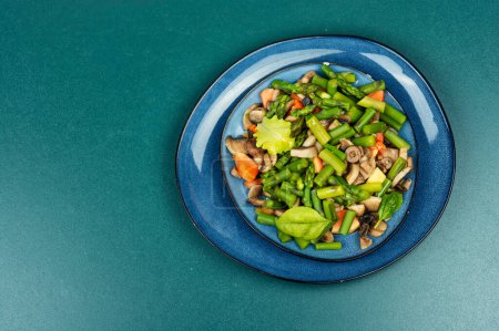 Photo for Tasty salad of green asparagus and roasted mushrooms. Menu, recipe place for text, top view - Royalty Free Image