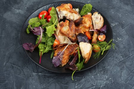 Photo for Sliced baked grilled chicken on a plate. - Royalty Free Image
