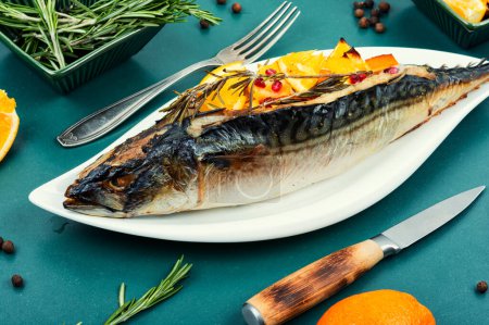 Photo for Appetizing mackerel fish baked with oranges and rosemary. Healthy food - Royalty Free Image