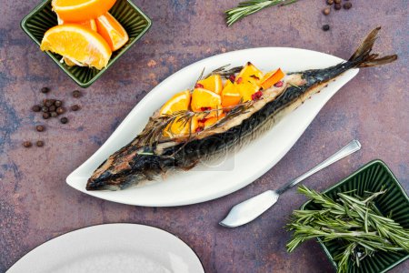 Photo for Whole mackerel fish baked with oranges and herb served on a stylish plate. Seafood. - Royalty Free Image