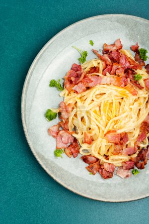 Photo for Pasta with fried bacon on a plate, pasta carbonara. Keto diet. Flat lay. - Royalty Free Image
