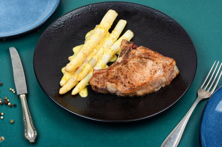 Photo for Roasted meat steak with boiled white asparagus. Healthy dinner. - Royalty Free Image