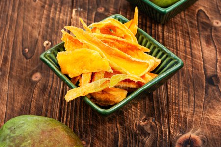 Photo for Raw dried mango and fresh ripe mango fruit on wooden rustic table - Royalty Free Image