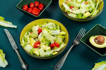 Photo for Green vegan salad made from a mix of green leaves and vegetables. Vegetable food concept. - Royalty Free Image