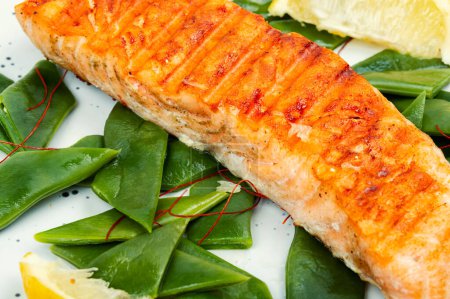 Photo for Seared salmon or trout steak with green bean - Royalty Free Image