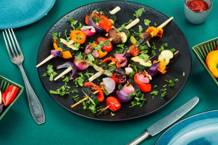 Photo for Yummy vegan shashlik of roasted vegetables on wooden skewers. BBQ. - Royalty Free Image