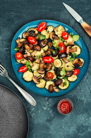 Photo for Mushrooms, zucchini and tomatoes baked in the oven. Vegan lunch. - Royalty Free Image
