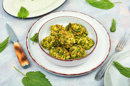 Healthy green dietary cutlets or meatballs made from young nettles. Vegetarian food.