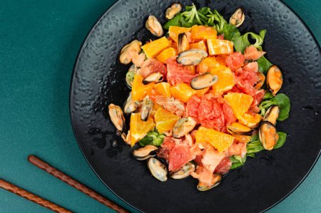 Photo for Seafood salad with grapefruit, orange and mussels. Top view. - Royalty Free Image