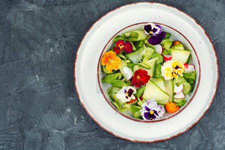 Photo for Raw fresh salad of cucumber, radish, green and flowers. Clean and healthy eating concept. Space for text. - Royalty Free Image