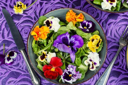 Detox delicious colorful edible flower salad. Healthy food. Top view.