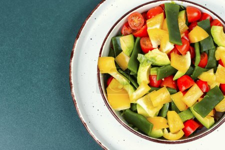 Photo for Healthy raw vegetable salad with bell pepper, tomato, avocado and runner beans. Copy space. - Royalty Free Image
