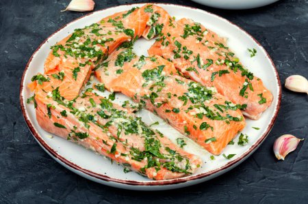 Photo for Fresh raw salmon fillet fish in garlic green marinade ready for baking. Gravlax. - Royalty Free Image