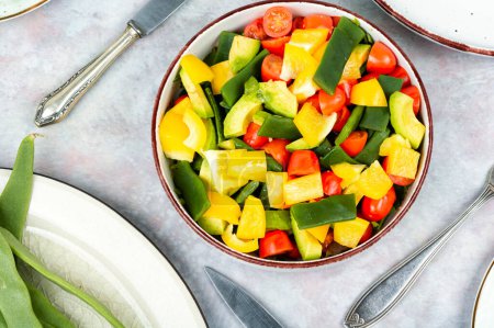 Photo for Tasty raw vegetable salad with bell pepper, tomato, avocado and runner beans or green bean. Vegetarian dish. Flat lay. Top view. - Royalty Free Image