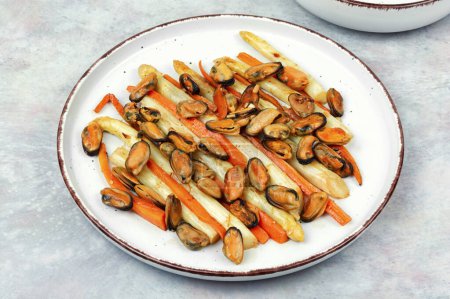 Photo for Luxury dish, salad of fried mussels, asparagus and carrots. - Royalty Free Image