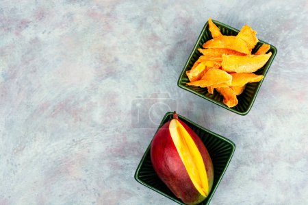 Photo for Dried mango slices, healthy snack. Copy space. - Royalty Free Image