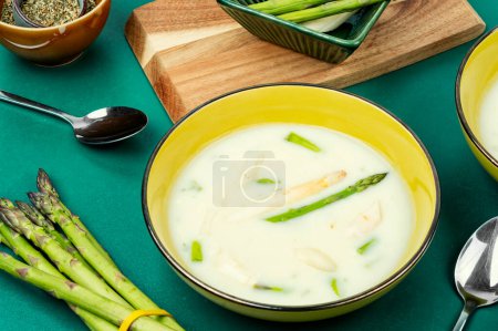 Photo for Bowl of delicious asparagus soup with white and green asparagus. Vegan. - Royalty Free Image