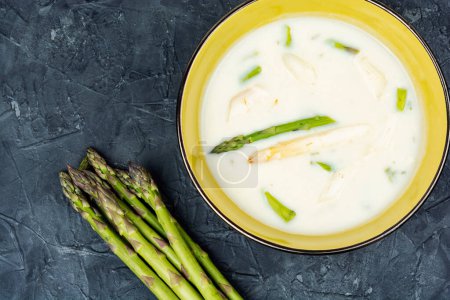 Bowl of asparagus soup with asparagus. Vegan. Copy space. Space for text.