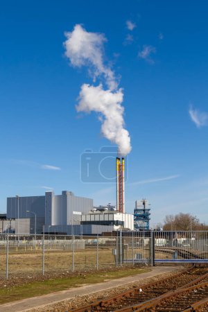 Photo for Waste to energy plant incineration and recycling plant with rail tracks in the foreground. - Royalty Free Image