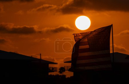 American Flag Lit Up by the Setting Sun