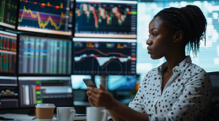In this dynamic photograph, a black woman exudes confidence as she embraces the future of finance in a cutting-edge office environment. With a smartphone in hand, she effortlessly manages her investments using the latest stock market app, while surro