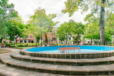 Photo for San Gil, Santander, Colombia, April 26, 2024, view of the main park of San Gil with the fountain in the center without water, due to the shortage due to the strong drought season - Royalty Free Image