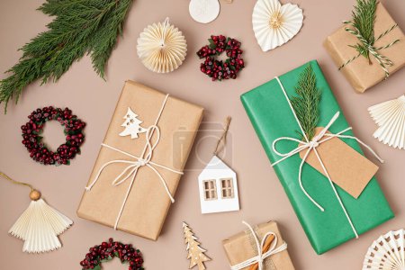 Photo for Christmas background with gift boxes. Xmas celebration, preparation for winter holidays, secret Santa concept. Festive mockup, top view, flat lay - Royalty Free Image