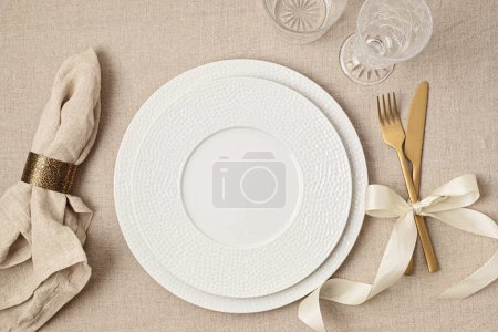 Foto de Festive wedding, birthday table setting with golden cutlery and porcelain plate. Empty plate mockup. Party menu template. Flat lay, top view - Imagen libre de derechos
