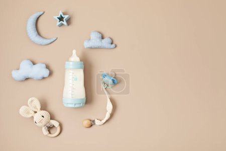 Photo for Flat lay with baby sleep accessories with milk bottles, pacifier and toys. Newborn sleeping rules concept - Royalty Free Image