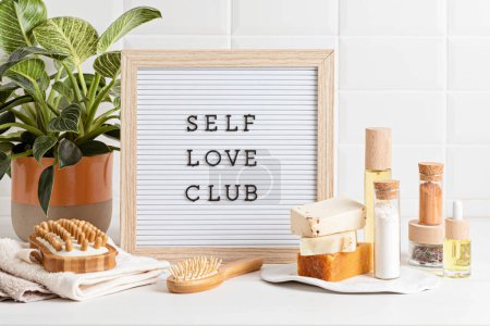 Photo for Bathroom styling and organization. Letter board with text Self Love Club. Organic lifestyle and skin care products. - Royalty Free Image