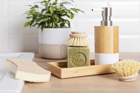 Photo for Home cleaning non toxic, natural products. Washing dishen in kitchen with olive oil soap and brushes. Plastic free, zero waste, sustainable lifestyle idea - Royalty Free Image