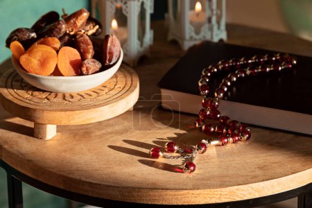 Photo for Ramadan Kareem and iftar muslim food, holiday concept. Trays with nuts and dried fruits and latterns with candles. Celebration idea - Royalty Free Image