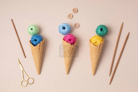 Photo for Colorful balls of organic cotton yarn waffle cones for ice cream . Recomforting hobby to reduce stress - Royalty Free Image