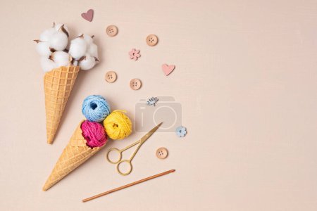 Photo for Colorful balls of organic cotton yarn waffle cones for ice cream . Recomforting hobby to reduce stress - Royalty Free Image
