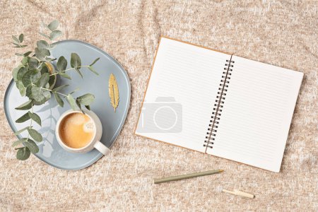 Photo for Mockup of notebook and coffee cup on beige plaid background, with copy space for text. Flat lay, top view photo mock up. - Royalty Free Image
