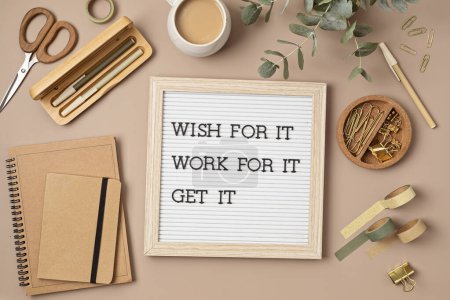 Photo for Flatlay of letter board with motivational quote. Office supplies made of recycled materials on beige background. - Royalty Free Image
