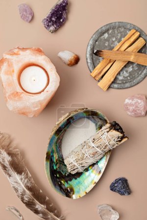 Photo for Smudge kit with white sage, palo santo, himalayan salt candle holder. Natural elements for wellbeing, elements for cleansing environment from negative energy, adding positive vibes. Spiritual practices - Royalty Free Image