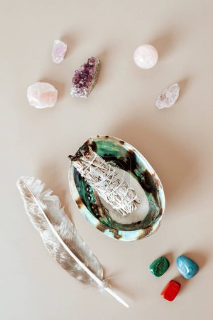 Photo for Smudge kit with white sage stick, abalone sea shell. Natural elements for cleansing environment from negative energy, adding positive vibes. Spiritual practices - Royalty Free Image