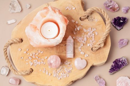 Photo for Himalayan rock salt candle holder and gemstones. Balance and calm energy flow at  home, purifying the air,  decrease stress level concept - Royalty Free Image