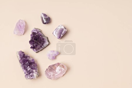 Photo for Healing reiki chakra crystals therapy. Alternative rituals with amethyst and rose quartz for wellbeing, meditation, relaxation, mental health, spiritual practices. Energetical power concept - Royalty Free Image