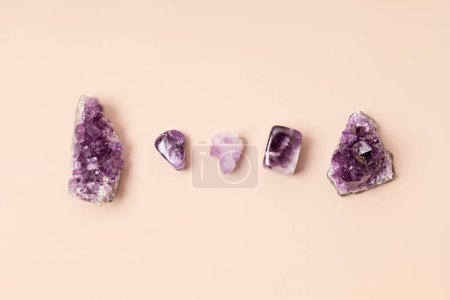 Photo for Healing reiki chakra crystals therapy. Alternative rituals with amethyst for wellbeing, meditation, relaxation, mental health, spiritual practices. Energetical power concept - Royalty Free Image
