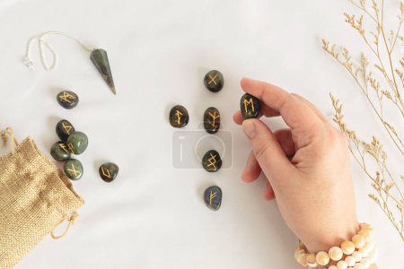 Photo for Set of rune stones for divination and fortune telling. Mystic still life with labradorite runes. Esoteric, occult , witchcraft rituals idea - Royalty Free Image