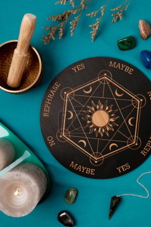 Photo for Pendulum board for divination, fortune telling or communicating with spirits. Magical crafting, witchcraft idea - Royalty Free Image