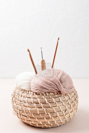Photo for Craft knitting hobby background with yarn in natural colors. Recomforting hobby to reduce stress for cold fall and winter weather. - Royalty Free Image
