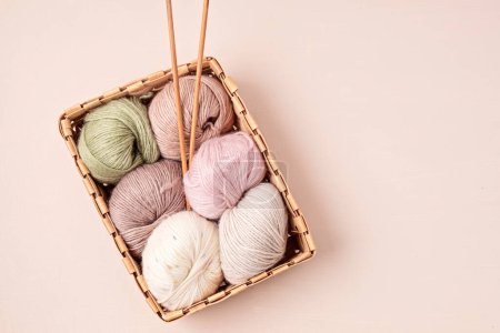 Photo for Craft knitting hobby background with yarn in natural colors. Recomforting hobby to reduce stress for cold fall and winter weather. - Royalty Free Image
