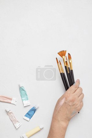 Photo for Artist painting colors with brushes. Craft hobby background. Recomforting, destressing hobby, art therapy - Royalty Free Image